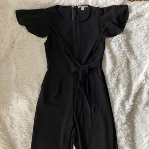 Black Jumpsuit with pockets. Size Small fits size 2-4.